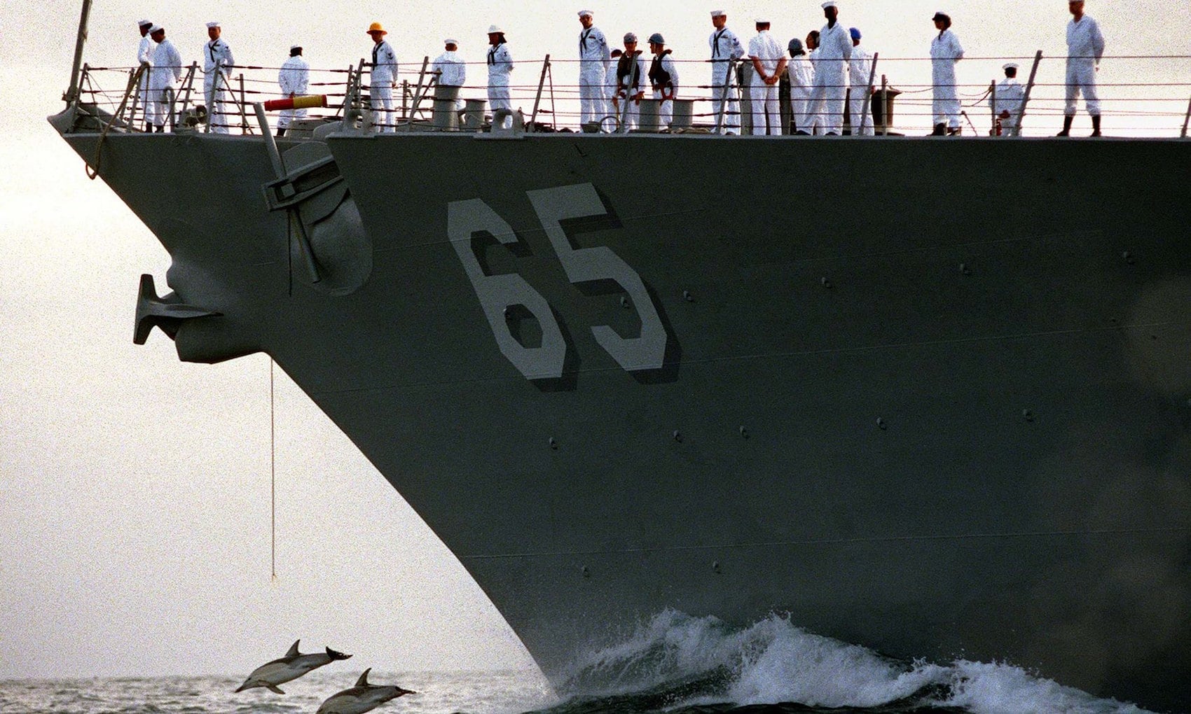 Image of dolphins in front of the USS Benfold No more. (From Mark Wilson/Reuters)